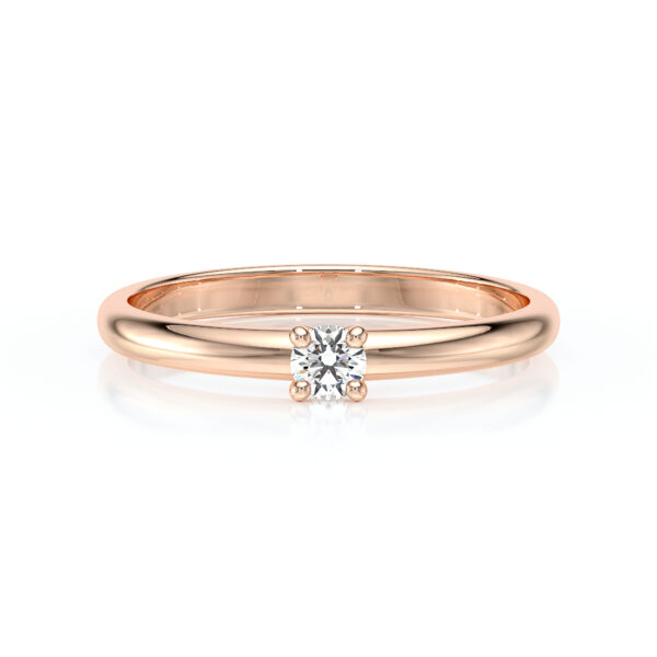 Solitaire 4 griffes avec un diamant rond serti sur une monture à corps rond en or 18 carats