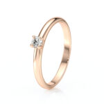 Solitaire 4 griffes avec un diamant rond serti sur une monture à corps rond en or 18 carats