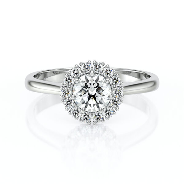 Bague en diamant ronde sertie de pierres précieuses, modèle élégant avec un design en halo, en or blanc brillant, symbole d'amour et de promesse, idéale pour des fiançailles ou anniversaires, mettant en valeur le scintillement des diamants.