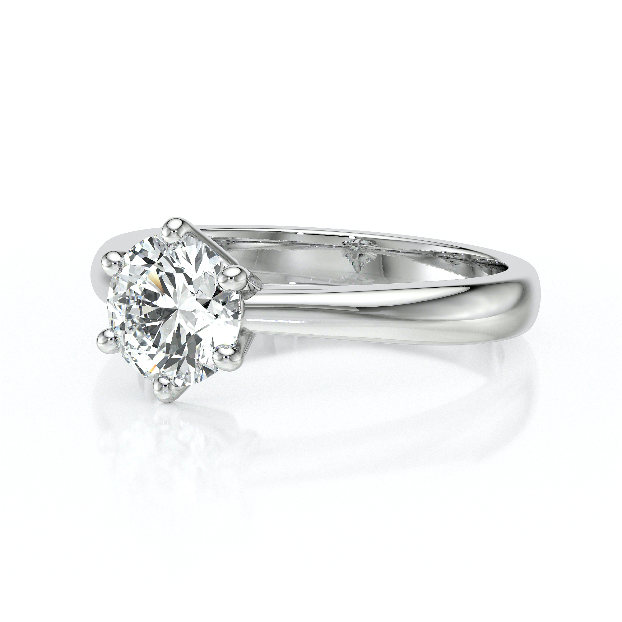 Bague de fiançailles élégante en or blanc avec un diamant rond brillant monté sur un serti à six griffes. Cette création raffinée incarne la romance et est idéale pour une demande en mariage inoubliable. Le design intemporel et scintillant de la bague attire l'œil et met en valeur la clarté du diamant, symbolisant l'amour éternel. Parfaite pour célébrer un engagement ou un moment spécial.