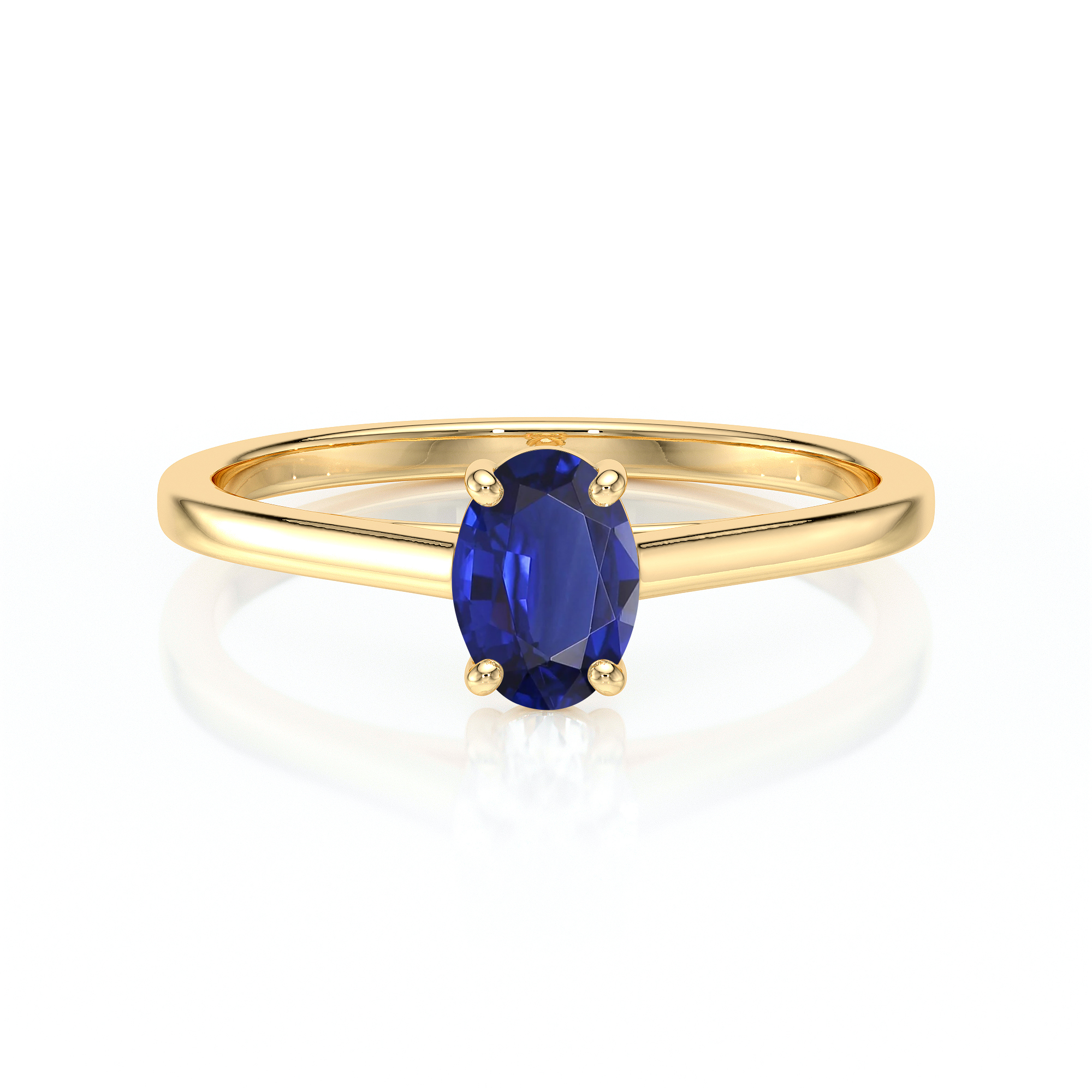 Bague en or jaune avec un saphir ovale bleu vif, serti de quatre griffes, mettant en valeur la gemme précieuse. Idéale pour les fiançailles ou comme bijou élégant, cette bague combine une esthétique moderne avec un design intemporel, parfaite comme symbole d'amour et d'engagement.