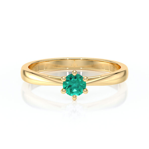 Bague en or jaune avec un élégant zircon vert, modèle moderne avec un design délicat et un sertissage en ivoire mettant en valeur la pierre centrale. Idéale pour les fiançailles ou comme bijou d'occasion spécial, parfaite pour un look contemporain et raffiné.