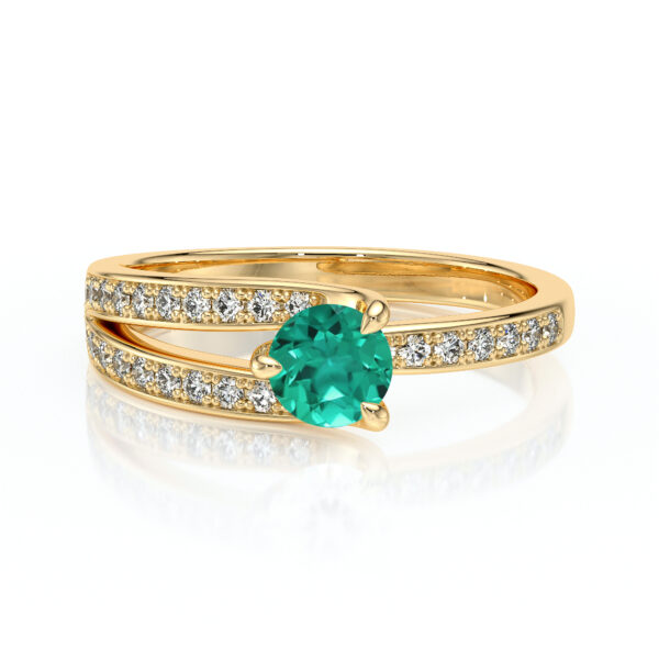 Bague en or avec un élégant design moderne, ornée d'une pierre précieuse turquoise ronde au centre et de petits diamants scintillants sur les bandes. Cette bague est parfaite pour un cadeau spécial ou un bijou de tous les jours, alliant charme et sophistication.