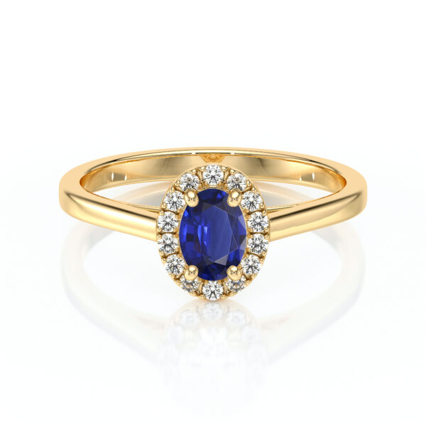 Bague en or avec un saphir bleu oval, entouré de diamants brillants, design élégant et intemporel, idéale pour une proposition ou un cadeau spécial, bijou de luxe.
