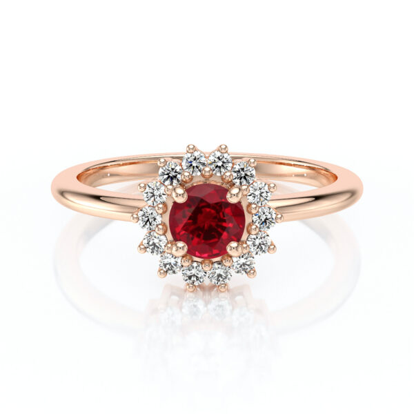 Bague en or rose ornée d'une pierre précieuse rouge entourée de diamants brillants, design élégant en forme de fleur, idéale pour les fiançailles ou comme bijou de luxe, modèle parfait pour un cadeau significatif.