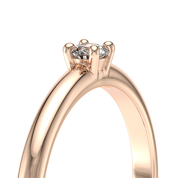 Solitaire 4 griffes avec un diamant rond serti sur une monture à corps rond en or 18 carats