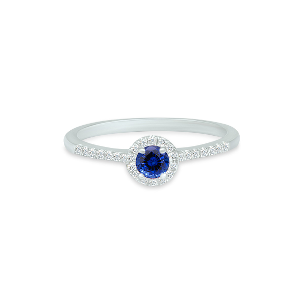 Bague en argent avec un diamant central bleu étincelant et un halo de petites pierres brillantes, design élégant et moderne, parfaite pour les fiançailles ou anniversaires.