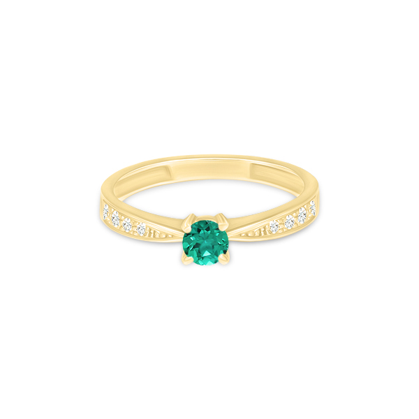 Bague en or jaune avec un bijou central en pierre précieuse verte et des diamants sertis sur le côté, idéale pour une proposition de fiançailles ou comme cadeau élégant, mettant en avant le design raffiné et la qualité des matériaux.